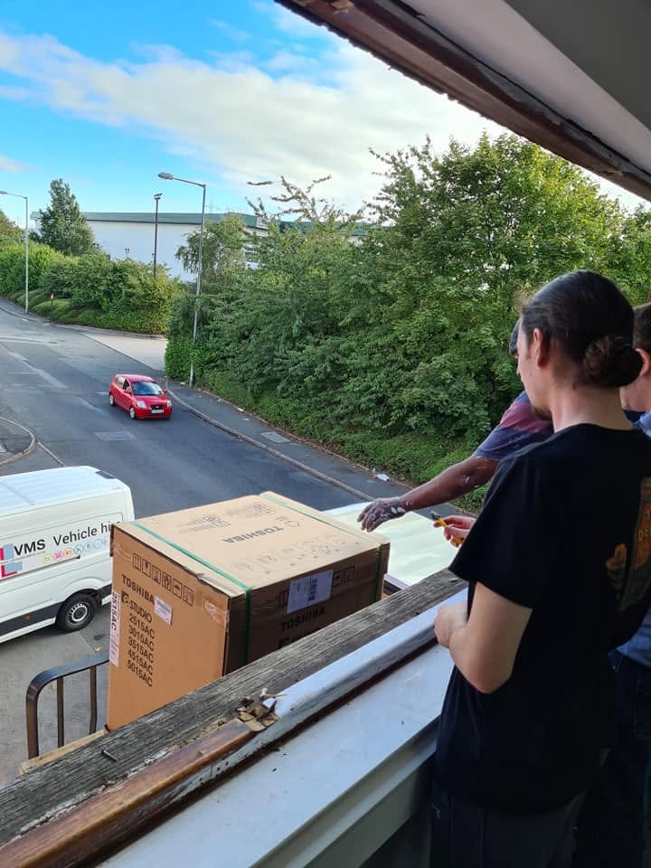 Birmingham 2 Toshiba photocopier being installed through an upper-floor window at a Birmingham customer site